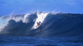 French Vahine Fierro rides a wave during the Tahiti Pro surfing competition, a test event for the Paris 2024 Olympics Games in Teahupo'o, French Polynesia in the Pacific Ocean, Friday, Aug. 11, 2023. (AP Photo/Esther Cuneo)