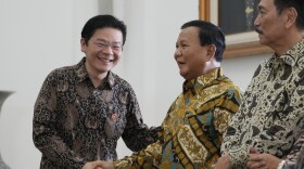 Indonesian Defense Minister and president-elect Prabowo Subianto, right, shakes hands with Singapore's Deputy Prime Minister and Finance Minister Lawrence Wong during their meeting at Bogor Presidential Palace in Bogor, Indonesia, Monday, April 29, 2024. (AP Photo/Achmad Ibrahim)