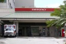 In this Aug. 24, 2021, file photo an ambulance sits outside the emergency room at The Queen's Medical Center in Honolulu. (AP Photo/Caleb Jones, File)