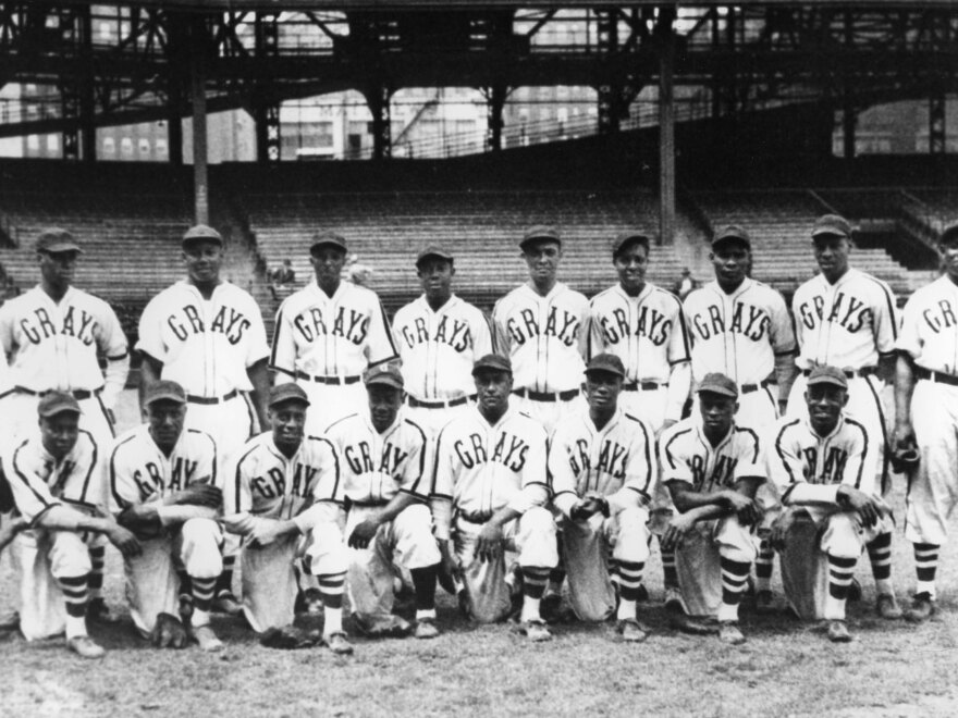 The Homestead Grays pose for a team shot in their home park, Forbes Field, in Pittsburgh in 1942. Hall of Fame members on the club include Josh Gibson, standing third from left, and Buck Leonard, standing far right.