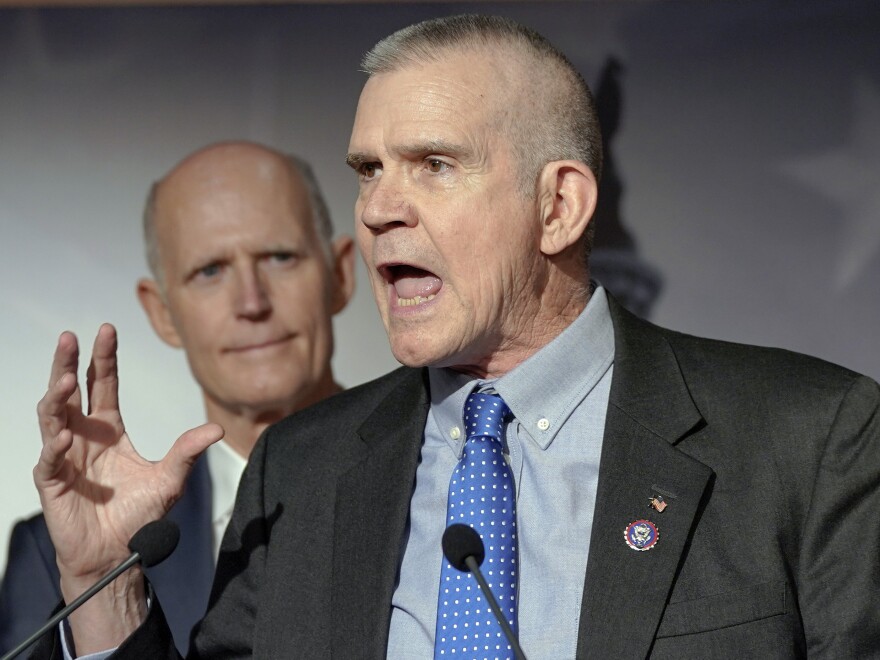 Rep. Matt Rosendale, R-Mont., right, speaks during a news conference on Capitol Hill on Jan. 10, 2024.