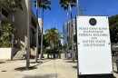 A sign for the Prince Jonah Kūhiō Kalanianaʻole Federal Building and Courthouse is displayed outside the courthouse on Monday, Jan. 22, 2024, in Honolulu. (AP Photo/Jennifer Kelleher)