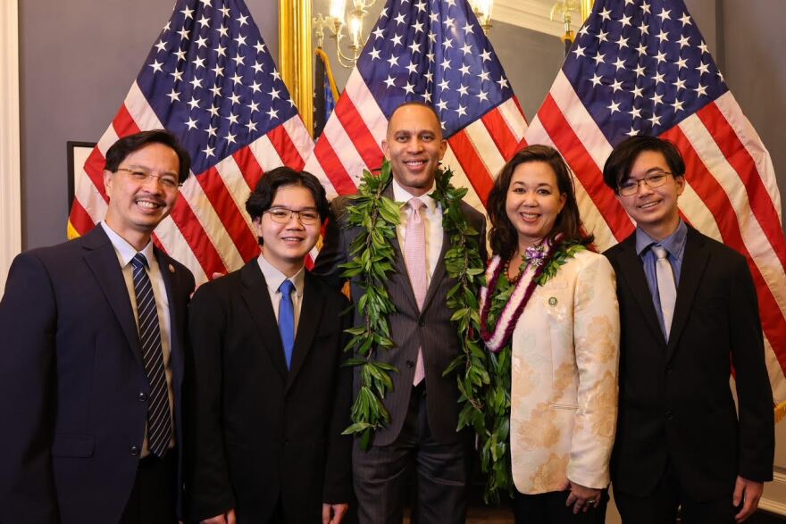 U.S. Rep. Jill Tokuda, House Minority Leader Hakeem Jeffries, middle, her husband Kyle, and their sons Matt and Aiden after Tokuda was sworn into office on Jan. 7, 2023.