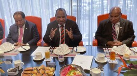 Papua New Guinea Prime Minister James Marape, center, gestures to New Zealand Prime Minister Chris Hipkins at a meeting ahead of the United States - Pacific Summit in Port Moresby, Papua New Guinea, Monday, May 22, 2023. 