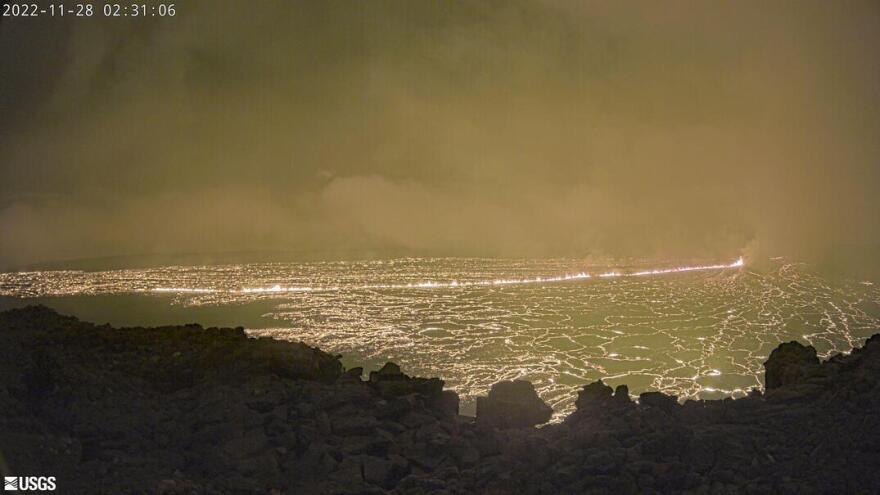 This image provided by the USGS Hawaiian Volcano Observatory shows a view from a research camera on the north rim of the summit caldera of the Maunaloa volcano, Monday, Nov. 28, 2022. The U.S. Geological Survey says the eruption began late Sunday night in the summit caldera of the volcano on the Big Island.