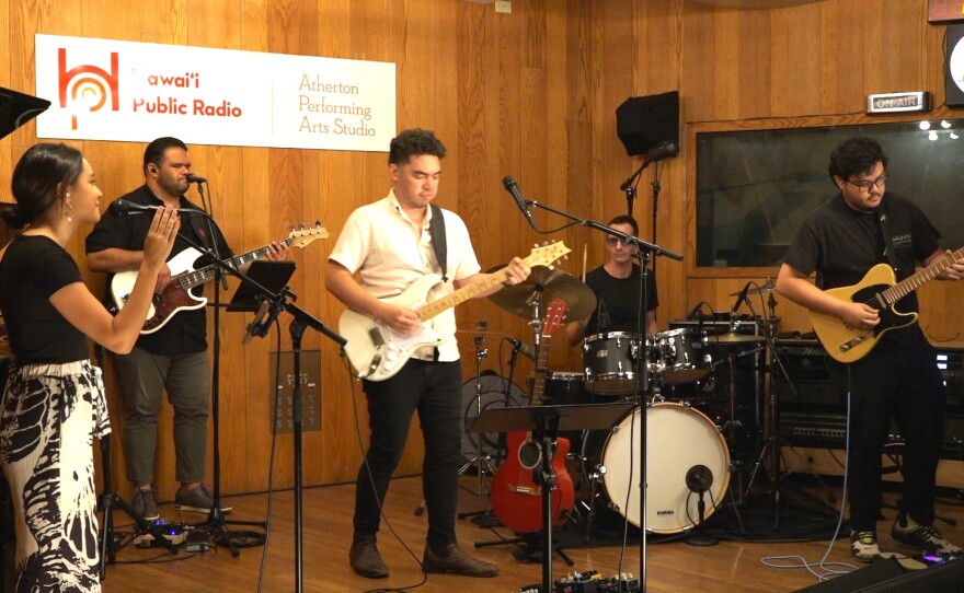 Left to right: Tiara Gomes (vocals), Wil Tafolo (bass), Evan Khay (vocals), Beck Millan (drums), and Hiʻi Copp (guitar).