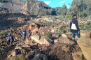 People gather at the site of a landslide in Maip Mulitaka in Papua New Guinea's Enga Province on May 24, 2024. Local officials and aid groups said a massive landslide struck a village in Papua New Guinea's highlands on May 24, with many feared dead.<br/>