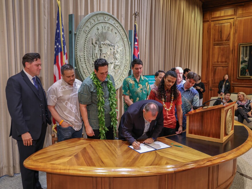 Gov. Josh Green signs bill regulating short term rentals on May 3, 2024.