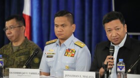 File - National Security Council spokesperson Jonathan Malaya, right, speaks beside Philippine coast guard spokesman, Commodore Jay Tarriela, center, and Armed Forces of the Philippines spokesperson Col. Medel Aguilar during a press conference on Monday, Dec. 11, 2023 in Manila, Philippines.