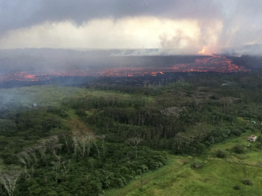 In this aerial photo provided by the U.S. Geological Survey, lava flows from fissure 8 near Pāhoa, Hawaiʻi on Wednesday, May 30, 2018. (U.S. Geological Survey via AP)