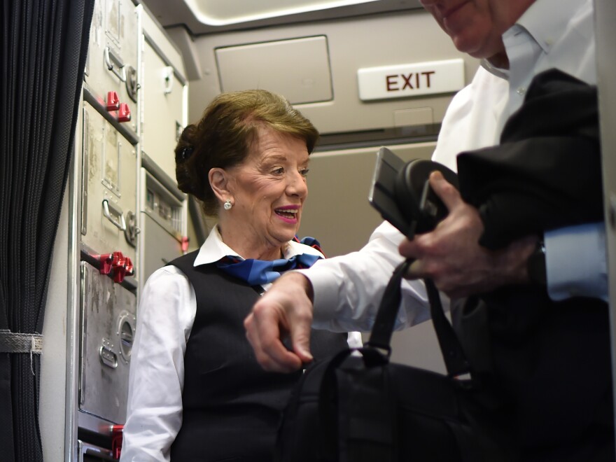 American Airlines flight attendant Bette Nash greets passengers disembarking from her daily return flight to Boston at Reagan Washington Airport in 2017, at age 81. She died earlier this month.