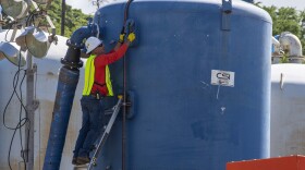 A Naval Facilities Engineering Systems Command contractor prepares a granular activated carbon filtration system to begin Red Hill Well recovery efforts at the facility in January 2022.