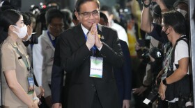 Thai Prime Minister Prayuth Chan-ocha, who is the candidate of the United Thai Nation Party to take the post again, arrives for official registration of party-list candidates in Bangkok, Thailand, Tuesday, April 4, 2023.