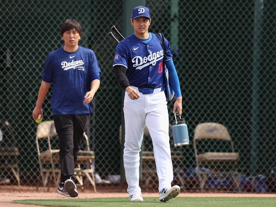 Ohtani, #17, and Mizuhara arrive to a spring training game in February, before the allegations about Mizuhara's gambling debts and theft had come to light. 