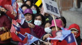 Supporters of Taiwan's Nationalist Party presidential candidate Hou Yu-ih cheer during his car campaign in New Taipei, Taiwan, Thursday, Jan. 11, 2024. Taiwan will hold its presidential election on Jan. 13. 