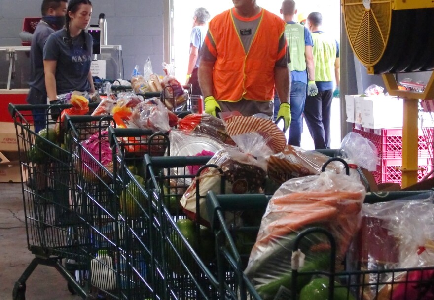 File - The Pantry in Kalihi has its online food distribution operations down to assembly-line precision.