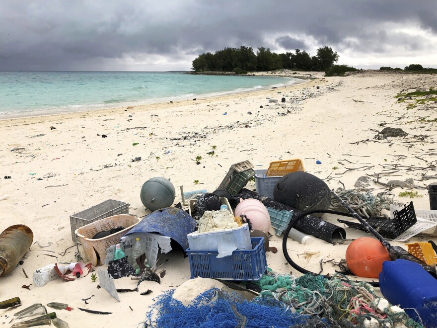 FILE - In this Oct. 22, 2019, photo, plastic and other debris is seen on the beach on Midway Atoll in the Northwestern Hawaiian Islands.