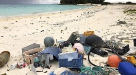 FILE - In this Oct. 22, 2019, photo, plastic and other debris is seen on the beach on Midway Atoll in the Northwestern Hawaiian Islands.