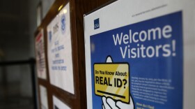 FILE - A sign at the federal courthouse in Tacoma, Wash., is shown on April 6, 2016, to inform visitors of the federal government's REAL ID Act, which requires state driver's licenses and ID cards to have security enhancements and be issued to people who can prove they are legally in the United States. The deadline for obtaining the Real ID needed to board a domestic flight has been pushed back again, with the Department of Homeland Security citing the lingering impact of the COVID-19 pandemic for the slower-than-expected rollout. (AP Photo/Ted S. Warren, File)