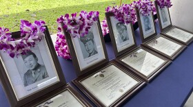 Photos of the men posthumously awarded Purple Heart medals sit on a table at Pearl Harbor, Hawaiʻi, on Friday, May 10, 2024. The families of five Hawaiʻi men who served in a unit of Japanese-language linguists during World War II received posthumous Purple Heart medals on behalf of their loved ones on Friday, nearly eight decades after the soldiers died in a plane crash in the final days of the conflict. (AP Photo/Audrey McAvoy)