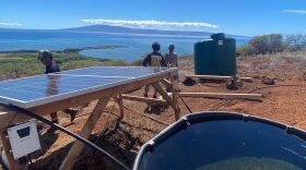 FILE - ʻĀina Momona sets up a 1,000-gallon water tank in the mauka portion of the Kaʻamola ahupuaʻa on Molokaʻi in November 2023.