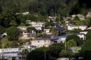 FILE - A neighborhood of single-family homes is shown Thursday, Dec. 24, 2015, in Honolulu. Two-thirds of the single family homes on Hawaiʻi's most populous island have no hurricane protections. This year's return of El Nino is highlighting this weakness because it boosts the odds that more tropical cyclones will travel through Hawaiʻi's waters this summer and fall.