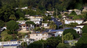 FILE - A neighborhood of single-family homes is shown Thursday, Dec. 24, 2015, in Honolulu. Two-thirds of the single family homes on Hawaiʻi's most populous island have no hurricane protections. This year's return of El Nino is highlighting this weakness because it boosts the odds that more tropical cyclones will travel through Hawaiʻi's waters this summer and fall.