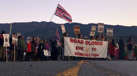 Demonstrators block a road at the base of Hawaii's tallest mountain, in Mauna Kea, Hawaii, on July 15, 2019, to protest the construction of a giant telescope on land that some Native Hawaiians consider sacred.