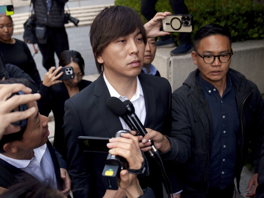 Ippei Mizuhara outside federal court on Tuesday after he pleaded guilty to two counts related to the transfer of nearly $17 million from the bank account of baseball star Shohei Ohtani to cover Mizuhara's gambling debts. 