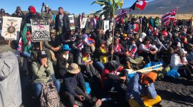 File - Demonstrators gather at Maunakea in 2019 to protest the construction of the Thirty Meter Telescope.