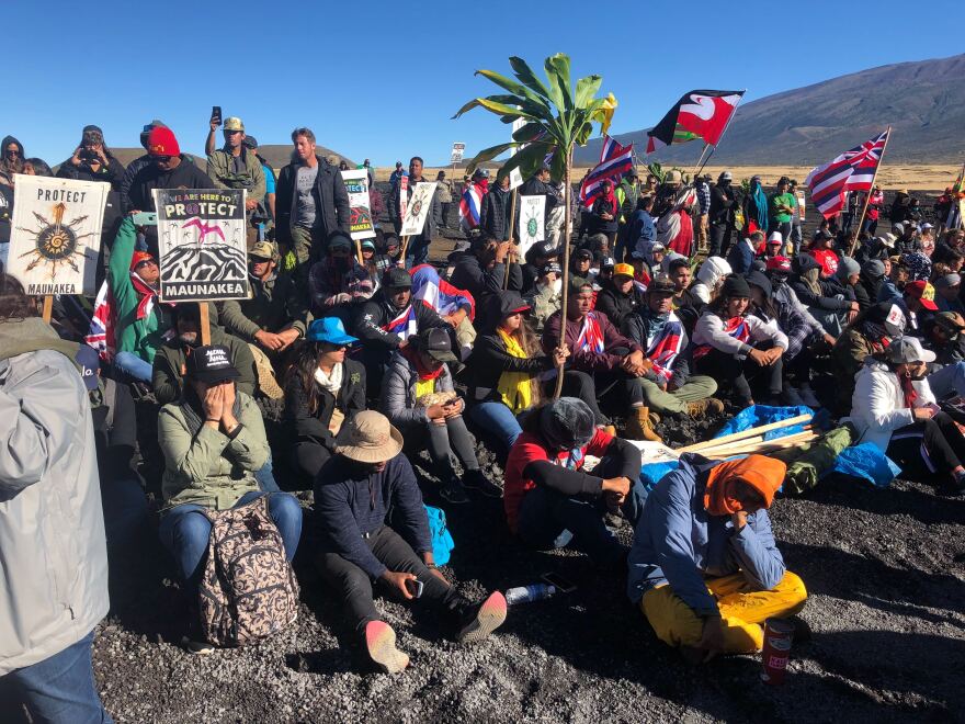 File - Demonstrators gather at Maunakea in 2019 to protest the construction of the Thirty Meter Telescope.