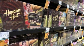 Packages of macadamia nuts are displayed on store shelves on Friday, April 26, 2024, in Honolulu. For decades, tourists to Hawaiʻi have brought home gift boxes of the islands' famous chocolate-covered macadamia nuts for friends and family. (AP Photo/Audrey McAvoy)