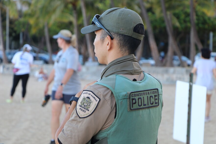 DLNR Division of Conservation and Resources Enforcement said officers are maintaining an around-the-clock presence to protect people and seals at Kaimana Beach. (Aug. 4, 2022)