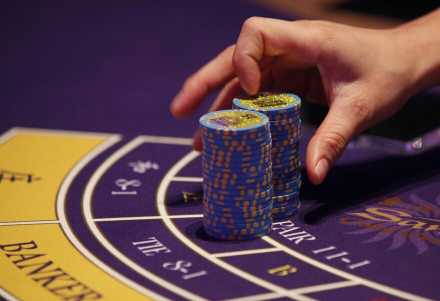 A croupier counts the chips at a baccarat gaming table inside a casino during the opening day of Sheraton Macao Hotel at the Sands Cotai Central in Macau Thursday, Sept. 20, 2012. The former Portuguese colony of Macau is still the only place where Chinese citizens can legally gamble in their own country.