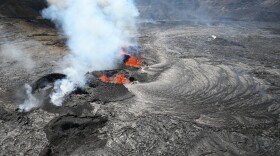 FILE-A view of the active fissure in Kīlauea summit caldera, with a chain of cinder cones as seen during an overflight on the afternoon of Sept. 14, 2023.