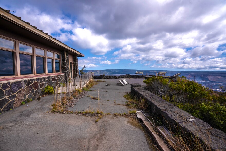 The cracked walkway to the viewing platform outside of the former Jaggar Museum with Halemaʻumaʻu Crater in the background. (Jan. 26, 2024)