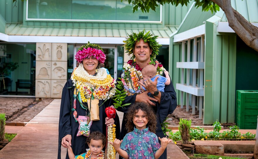 Pualei Lima, left, celebrated her master's in curriculum studies and Lohiao Paoa, right, earned an associate in applied science degree in Fire and Environmental Emergency Response, pictured here with their children.