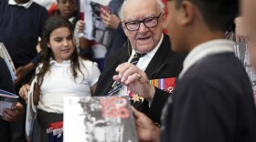 D-Day veteran and Ambassador for the British Normandy Memorial Ken Hay, 98, who served with the 4th Dorset Regiment, speaks to children during a visit to Rush Green Primary School in Dagenham, England, on Monday, May 20, 2024, ahead of the 80th anniversary of the D-Day landings.