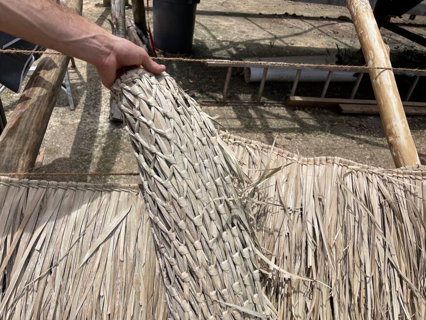 The thatch is made of hand-woven palm leaves.