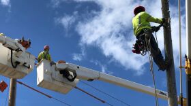 FILE - Hawaiian Electric lineworkers