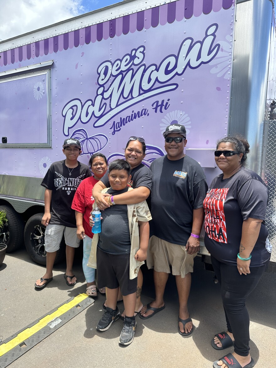 Dalilha Rodrigues, center, of Lahaina, with her family in front of their food truck, Dee's Poi Mochi.