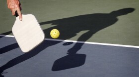 In this 2012 file photo, Del Teter competes in a game of pickleball at Sun City West senior community in Surprise, Ariz.