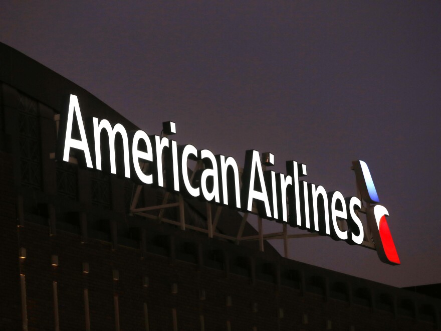 The NAACP is calling on American Airlines to provide an update on the pending investigations involving passengers and claims of racial discrimination. Here, the American Airlines logo stands atop the American Airlines Center on Dec. 19, 2017, in Dallas.