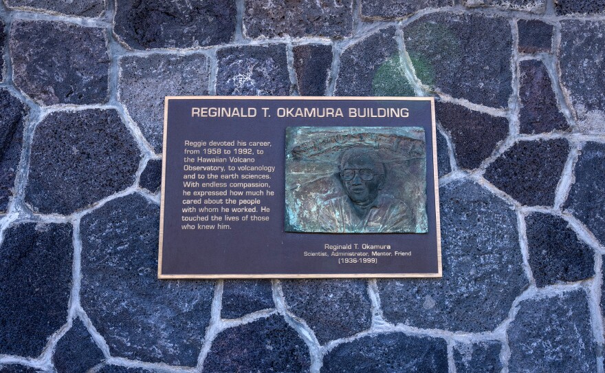 The Reginald T. Okamura Building plaque hanging on the USGS Okamura building rock facade. (Jan. 26, 2024)