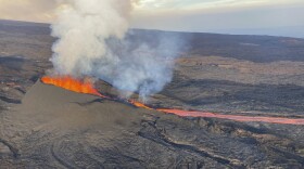 In this aerial image provided by the U.S. Geological Survey, fissure 3 is seen erupting on the Northeast Rift Zone of Maunaloa on Wednesday, Dec. 7, 2022. The world's largest volcano continues to erupt but scientists say lava is no longer feeding the flow front that has been creeping toward a crucial highway. That means the flow isn't advancing and is no longer an imminent threat to the road that connects the east and west sides of the Big Island. (U.S. Geological Survey via AP)