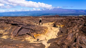 A hiker on Maunaiki Trail in Hawaiʻi Volcanoes National Park.