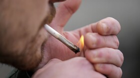 FILE - A man smoking cannabis in Germany on April 1, 2024. Germany is the third European Union country to legalize cannabis for personal use after Malta and Luxembourg.