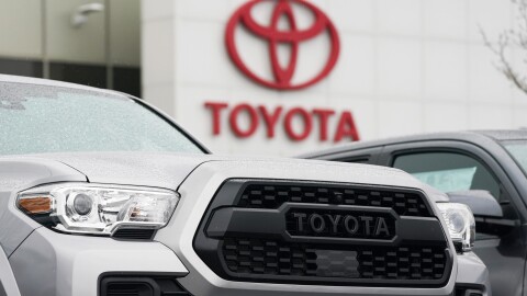 File - A logo of Toyota Motor Corp. is seen at its dealership in Lakewood, Colo., on March 21, 2021.