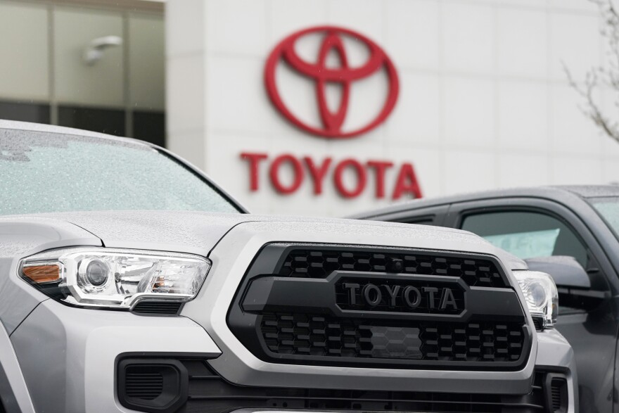 File - A logo of Toyota Motor Corp. is seen at its dealership in Lakewood, Colo., on March 21, 2021.