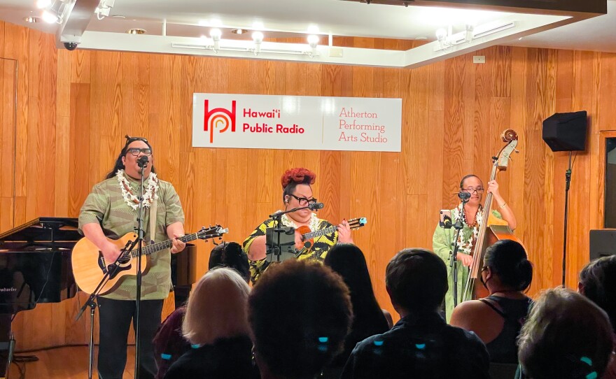 Cousins Lina Robins-Tamure, Heather Kapuaokamakahala Kalua and Jordan ʻĀina Asing come together as the beloved Hawaiian music trio, ʻUheʻuhene.